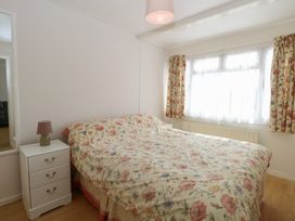 A bedroom with a bed and a bedside table at 440 California Sands