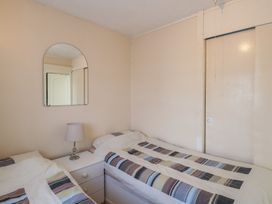 A bedroom with two beds and a dresser at 440 California Sands