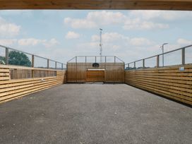 An outdoor area with a wooden fence and basketball hoop at 440 California Sands
