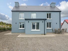 A house with windows and patio furniture at Valley View House in Kealkill, County Cork