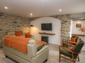 A living room with sofas and a television at Valley View House in Kealkill, County Cork