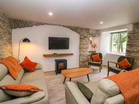A living room with a television and seating at Valley View House in Kealkill, County Cork