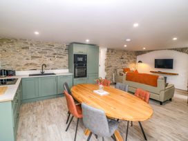 A kitchen and living area with dining table and seating at Valley View House Kealkill County Cork