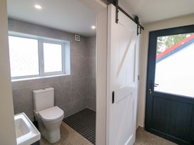 A bathroom with a toilet and shower at Valley View House in Kealkill, County Cork