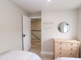 A bedroom with a dresser and mirror at Valley View House, Kealkill, County Cork