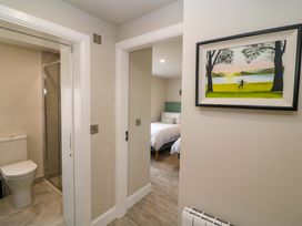 A hallway with a toilet and shower on the left and a bedroom visible on the right at Valley View House, Kealkill, County Cork