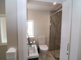 A bathroom with a toilet, sink, and shower at Valley View House, Kealkill, County Cork