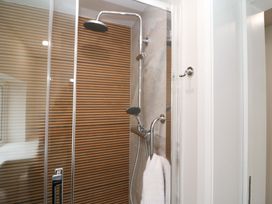 A shower with glass door and towel in Valley View House, Kealkill, County Cork