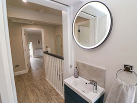 A sink with a mirror in a bathroom at Valley View House, Kealkill, County Cork
