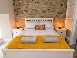 A bedroom with a bed and nightstand at Valley View House in Kealkill, County Cork