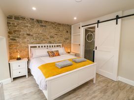 A bedroom with a bed and nightstand at Valley View House Kealkill, County Cork