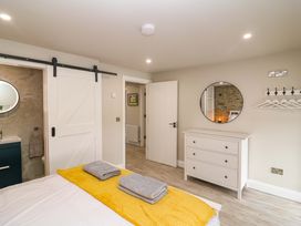A bedroom with a bed and dresser at Valley View House, Kealkill, County Cork