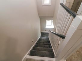A staircase with stairs and a window at Valley View House Kealkill, County Cork