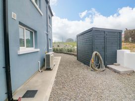 An outdoor area with a shed and an air conditioning unit at Valley View House in Kealkill, County Cork