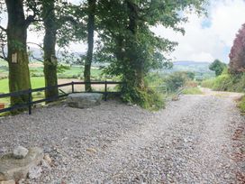 A gravel path with trees and a fence at Valley View House in Kealkill, County Cork