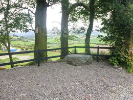 A viewpoint with trees and a rock at Valley View House in Kealkill, County Cork