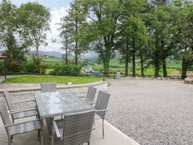 An outdoor dining area with a table and chairs at Valley View House in Kealkill, County Cork