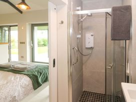 A bathroom with a shower and sink at The Stall near Kealkill, County Cork