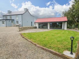 A house with a red roof and lawn area at The Stall near Kealkill, County Cork