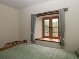 A bedroom with a window and bed at Howgill Head Kendal