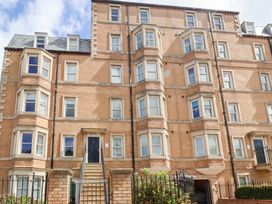 A building with multiple windows and a door at Belle's View in Scarborough