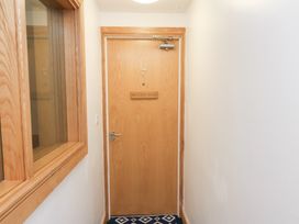 A corridor with a door marked 7 at Belle's View in Scarborough