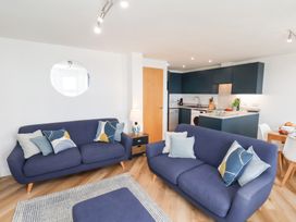 A living room with sofas and a coffee table at Belle's View in Scarborough