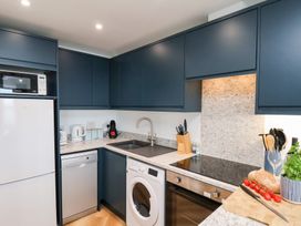 A kitchen with appliances and utensils at Belle's View in Scarborough