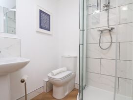 A bathroom with a shower and toilet at Belle's View in Scarborough