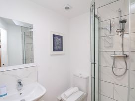 A bathroom with a sink, toilet, and shower at Belle's View in Scarborough