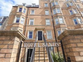 An apartment building entrance with a staircase at Royal Sands in Scarborough