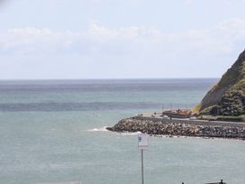 A coastline with a road and vehicles at Belle's View in Scarborough