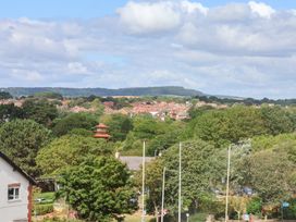 A view of houses and trees under a cloudy sky at Belle's View in Scarborough