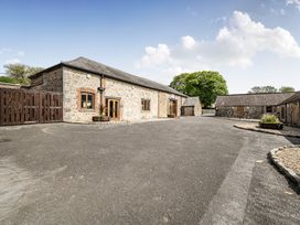 An outdoor view of a stone building with a gravel area at Harcombe House Rooms Accessible Ground Floor Twin Chudleigh