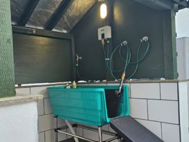 A bathtub and fixtures in a bathroom at Driftwood in Bridlington