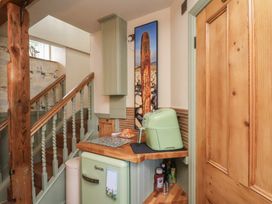 A kitchen with a fridge and countertop at Driftwood in Flamborough