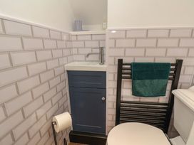 A bathroom with a sink and toilet at Driftwood in Flamborough