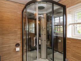 A shower enclosure in a bathroom at Driftwood in Flamborough