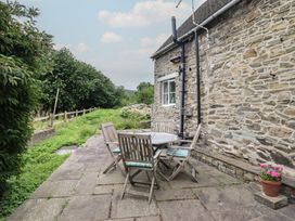 An outdoor seating area with a table and chairs at Hafod in Llangollen