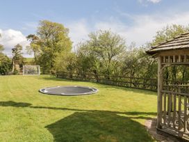 An outdoor area with a trampoline and goal at Cyffdy Cottage - Arenig Bala