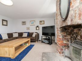 A living room with a sofa and coffee table at Shelstone in Whitby