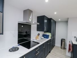 A kitchen with a stove and cabinets at Shelstone in Whitby