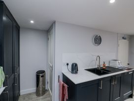 A kitchen with a sink and kettle at Shelstone in Whitby