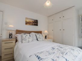 A bedroom with a bed and wardrobe at Shelstone in Whitby