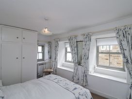 A bedroom with a bed and wardrobe at Shelstone in Whitby