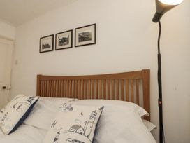 A bedroom with a bed and lamp at Shelstone in Whitby