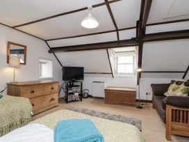 A bedroom with a bed and tv at Shelstone in Whitby