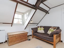 A seating area with a sofa and lamp at Shelstone in Whitby