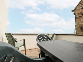 A table and chairs on an outdoor patio at Shelstone in Whitby
