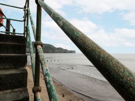 A staircase near the ocean with a railing and clouds at Shelstone in Whitby
